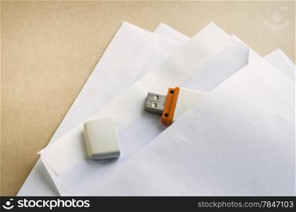 Stacked envelopes and flash drives