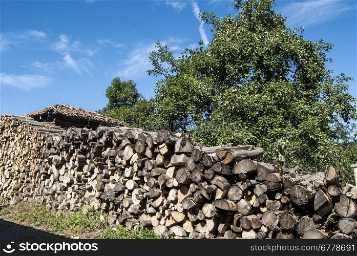 Stacked oak firewood heap in countryside