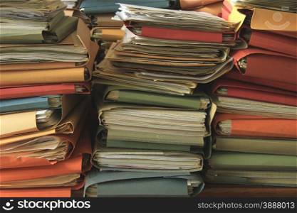 Stacked office files: pile of files in an office