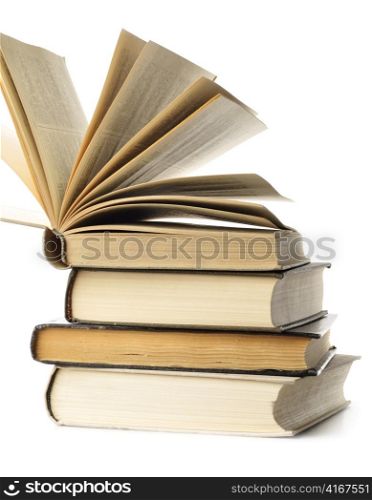stacked old books are isolated on white