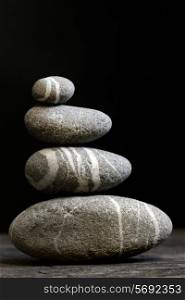 Stacked stones on a black background