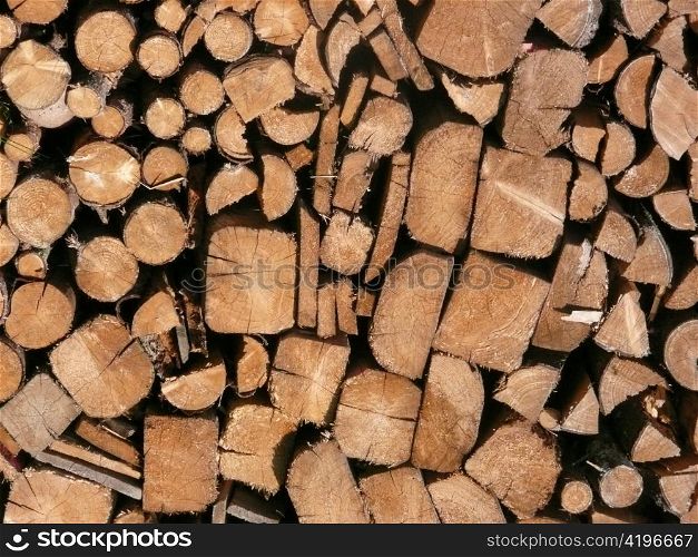stacked wood as firewood in a forest. heating with wood stove