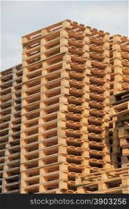 Stacked wooden pallets at a pallet storage