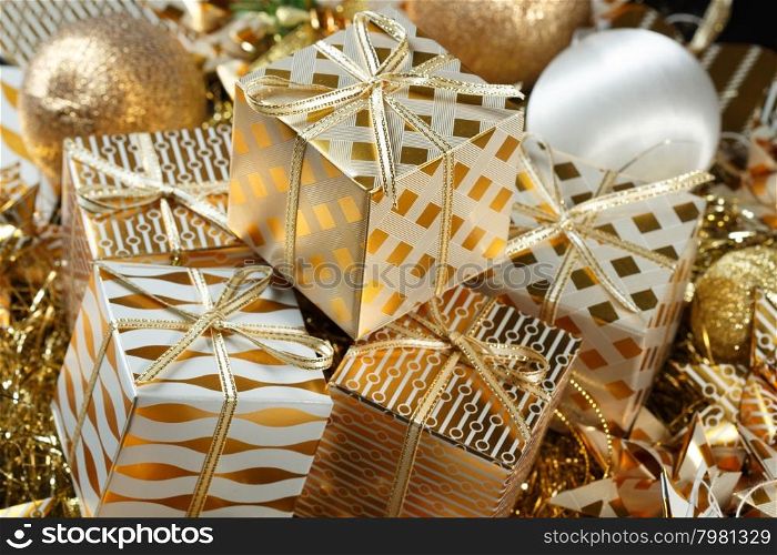 Stacks of golden Christmas presents