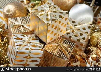 Stacks of golden Christmas presents