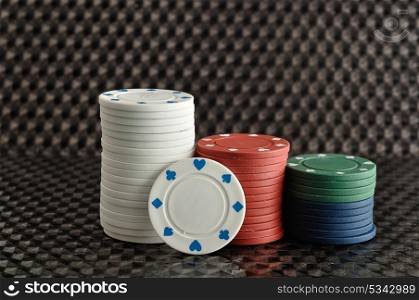 Stacks of poker chips with a black background