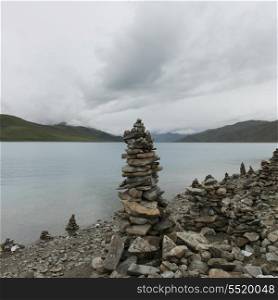 Stacks of stones at the lakeside, Yamdrok Lake, Nagarze, Shannan, Tibet, China