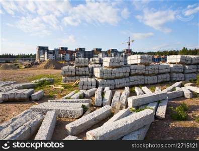 Stacks of street stones brought to a new suburb area yet under construction