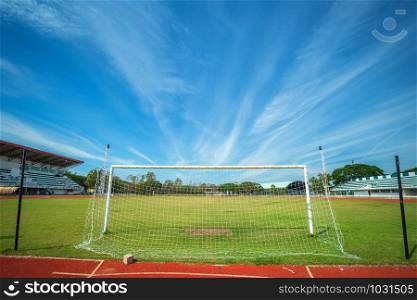 Stadium Soccer goal or football goal at of stadium with blue sky background.