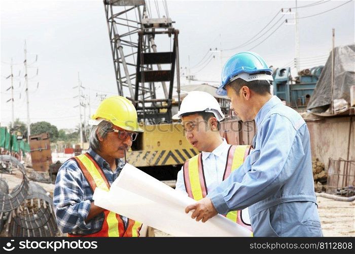 staff engineer bored pile team planning work in construction site. group of engineers consulting problem work on site