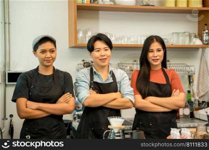 Staff In Coffee Shop,Portrait of owner or barista in apron standing at the bar of the modern cafe.
