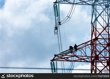 staff installation and modification of high voltage electrical cable system and cloud sky background Thailand