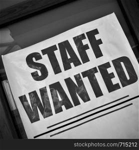 Staff wanted - job vacancy poster in a show-case. Black and white