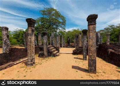 Stainding Buddha statue in ancient ruins. So-called Quadrangle in ancient city Polonnaruwa - famous tourist destination and archaelogical site, Sri Lanka. Stainding Buddha statue in ancient ruins