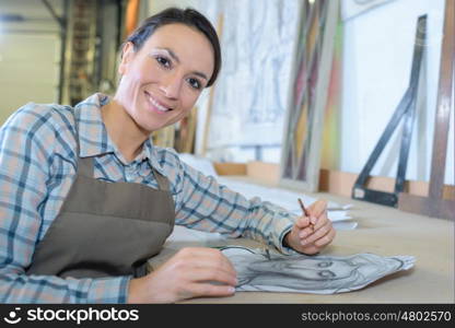 stained glass artist posing