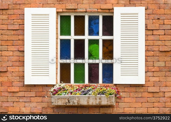 Stained Glass Window on brick wall