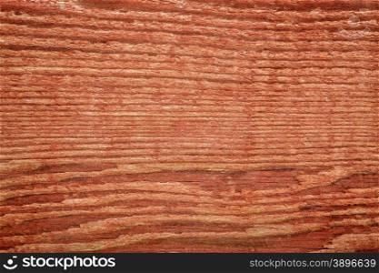 stained red weathered barn wood background texture - macro shot
