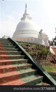 Staircase and white stupa in Sapugoda temple in Beruwala, Sri Lanka