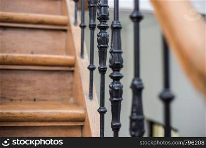 Staircase Handrailing in Old Historic Building. Interior Decor of Vintage Stairs with Metal Ornament and White Wall Background. House Design Detail of Historical Stair Case with No People Close Up. elemants. Staircase Handrailing in Old Historic Building. Interior Decor of Vintage Stairs with Metal Ornament and White Wall Background. House Design Detail of Historical Stair Case with No People Close Up.