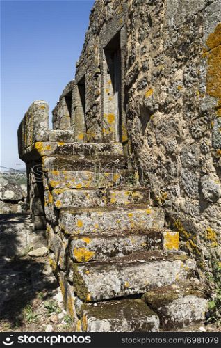 Staircase of a traditional local granite house of the rural architecture of the Beira Alta region in Portugal