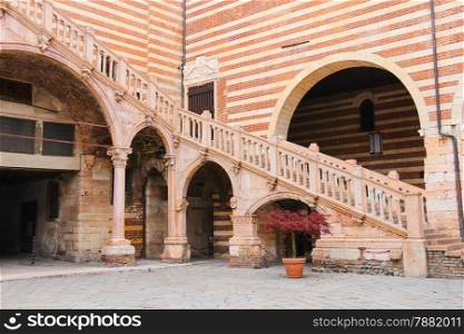 Staircase of reason in courtyard the Palazzo della Ragione in Verona, Italy