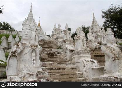 Staircase with white dtatues on the bank of river in Mingun, Myanmar