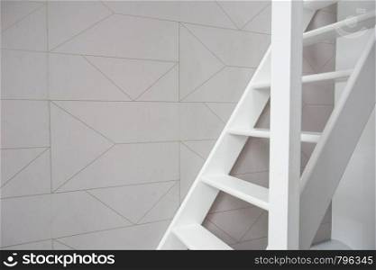 Stairs in modern white room, white wooden stairs with white wall modern retro wallpaper. Stairs in modern white room, white wooden stairs with white wall retro wallpaper