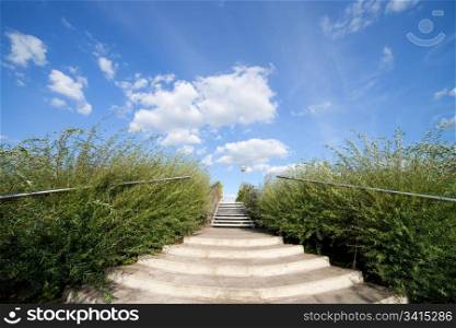 Stairs to the big blue sky and clouds abstract concept