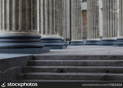 Stairs to the colonnade, classical Corinthian column older close up