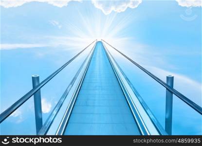 Stairway to heaven with blue sky, clouds and god sun light. Religion concept