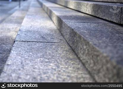 Stairway with granite stone steps in perspective, close up