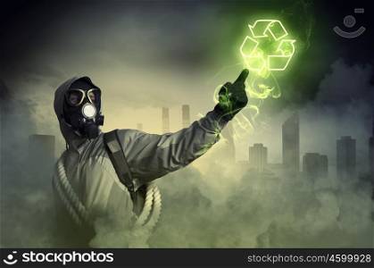 Stalker and recycle sign. Man in respirator against nuclear background touching symbol. Recycle concept