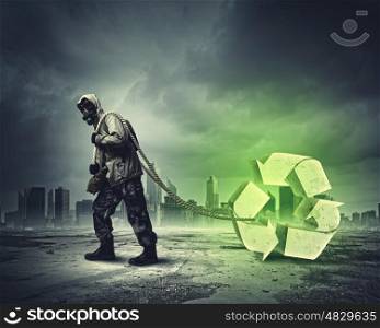 Stalker in gas mask. Man in respirator against catastrophe background. Recycle concept