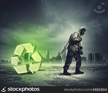 Stalker in gas mask. Man in respirator against catastrophe background. Recycle concept