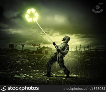 Stalker in gas mask. Man in respirator against nuclear background. Recycle concept