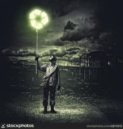 Stalker in gas mask. Man in respirator against nuclear background. Recycle concept