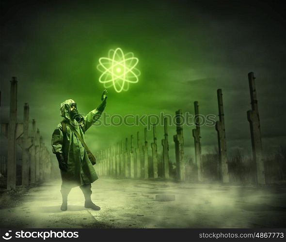 Stalker pulling rope. Man in respirator against nuclear background. Radioactivity concept