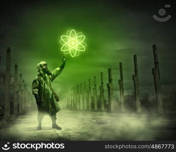 Stalker pulling rope. Man in respirator against nuclear background. Radioactivity concept