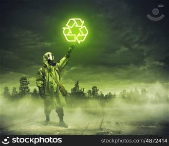 Stalker pulling rope. Man in respirator against nuclear background. Recycle concept
