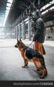 Stalker soldier in gas mask and dog in abandoned building, survivors after nuclear war. Post apocalyptic world. Post-apocalypse lifestyle on ruins, doomsday, judgment day