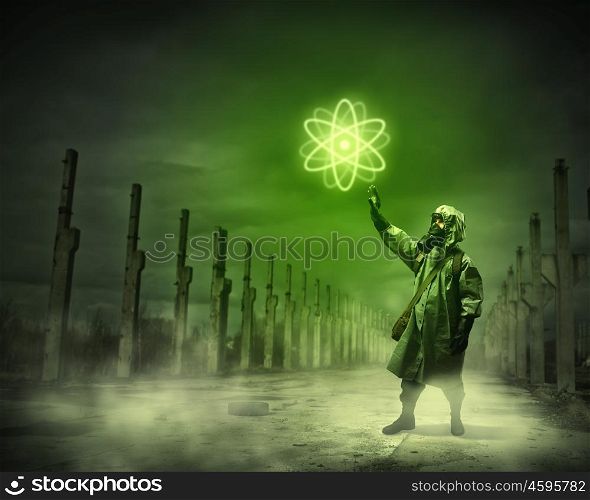 Stalker touching sign. Image of man in gas mask and protective uniform touching atom sign
