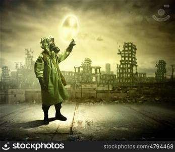 Stalker touching sign. Image of man in gas mask and protective uniform touching radioactivity sign