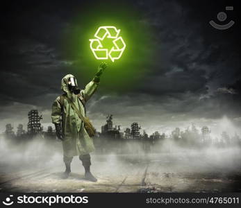 Stalker touching sign. Image of man in gas mask and protective uniform touching recycle sign