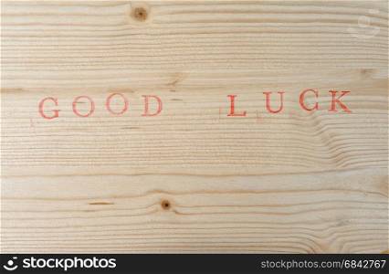 Stamped text Good luck on wood, background