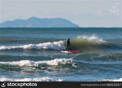 Stand up paddle board, surfer man paddleboarding on board