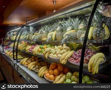 Stand with fruits . Stand with fruits at the restaurant (buffet)