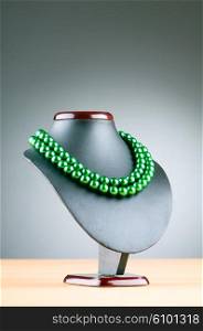 Stand with necklace in fashion concept