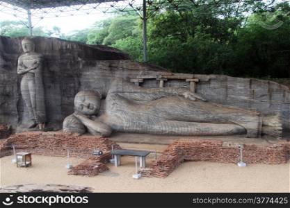 Standing and sleeping Buddhas under roof in Gal Vihara in Polonnaruwa, Sri Lanka