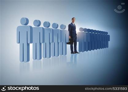Standing out from crowd concept with businessman