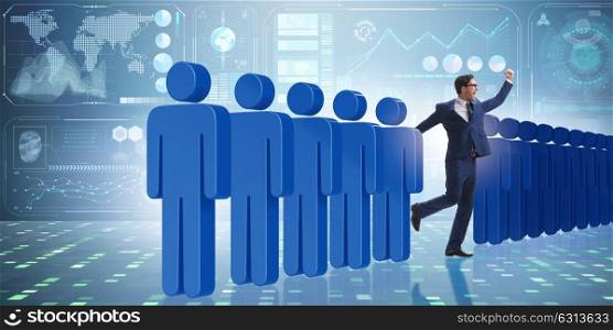Standing out from crowd concept with businessman. The standing out from crowd concept with businessman